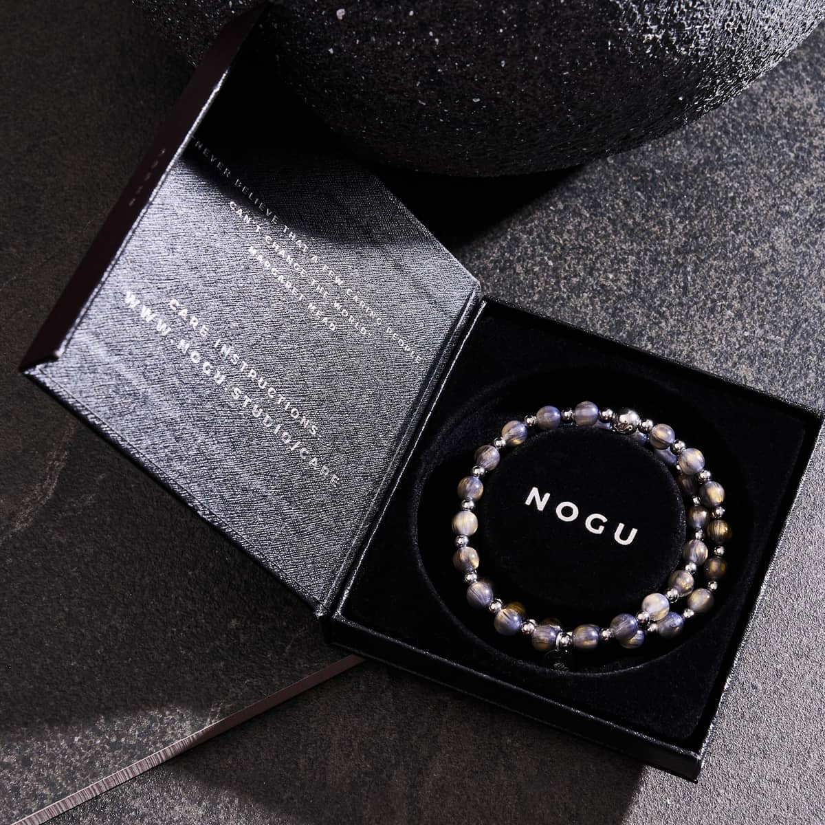 Chocolate Granite Dreamscape Opal Wrap with iridescent 6mm beads in black gift box with NOGU logo and stainless steel accents by NOGU